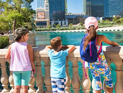 Group of kids in Las Vegas looking at the Bellagio fountains