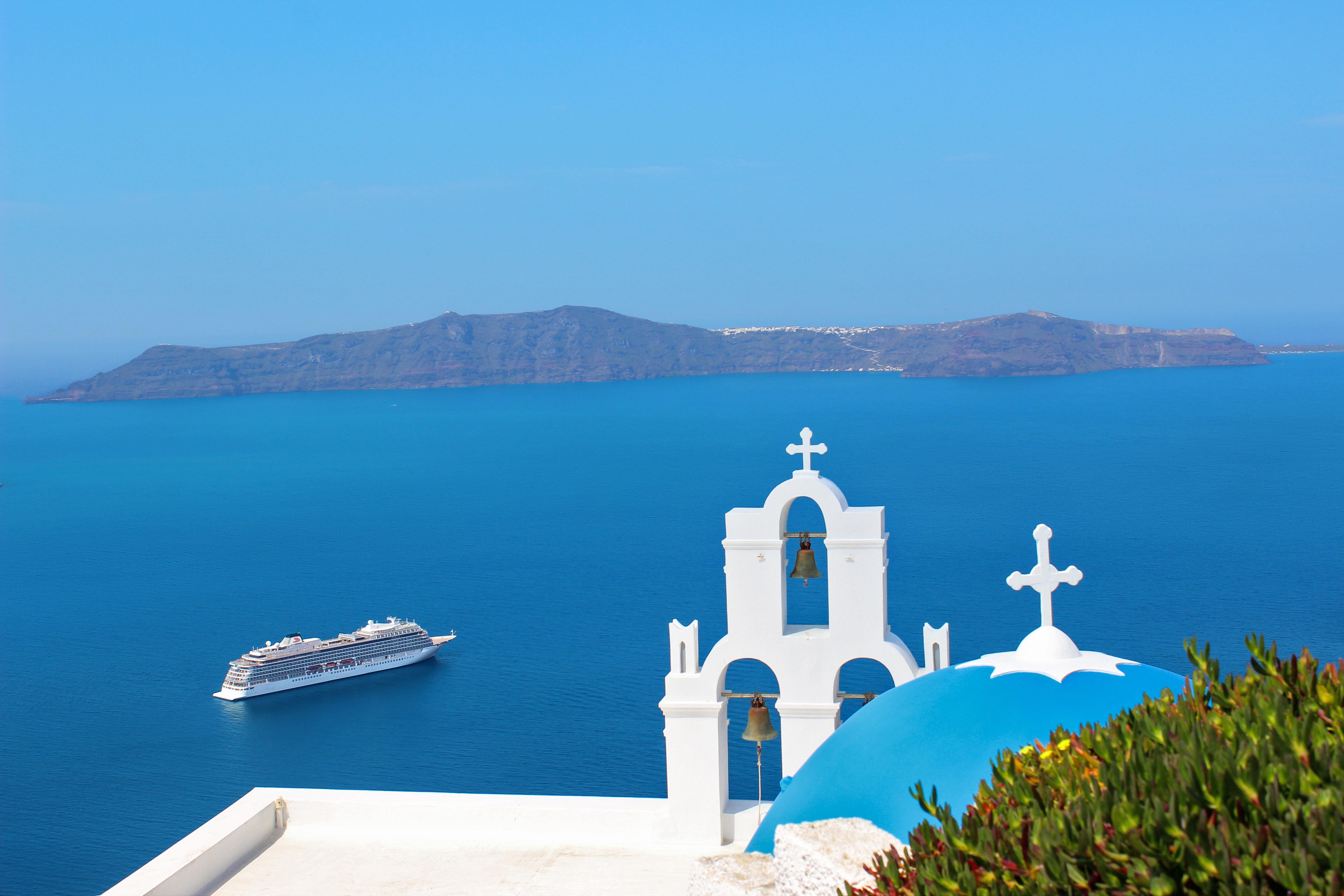 Journey to famed cities and ports like Santorini, Greece with Europe cruises