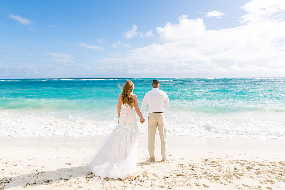 Newlywed couple on the beach at a Majestic Resort