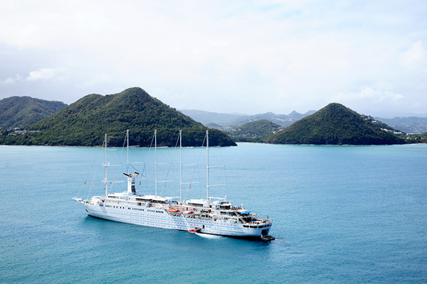 Cruise ship sailing past a group of Southern Caribbean islands