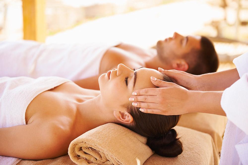 Couple at spa getting a massage.