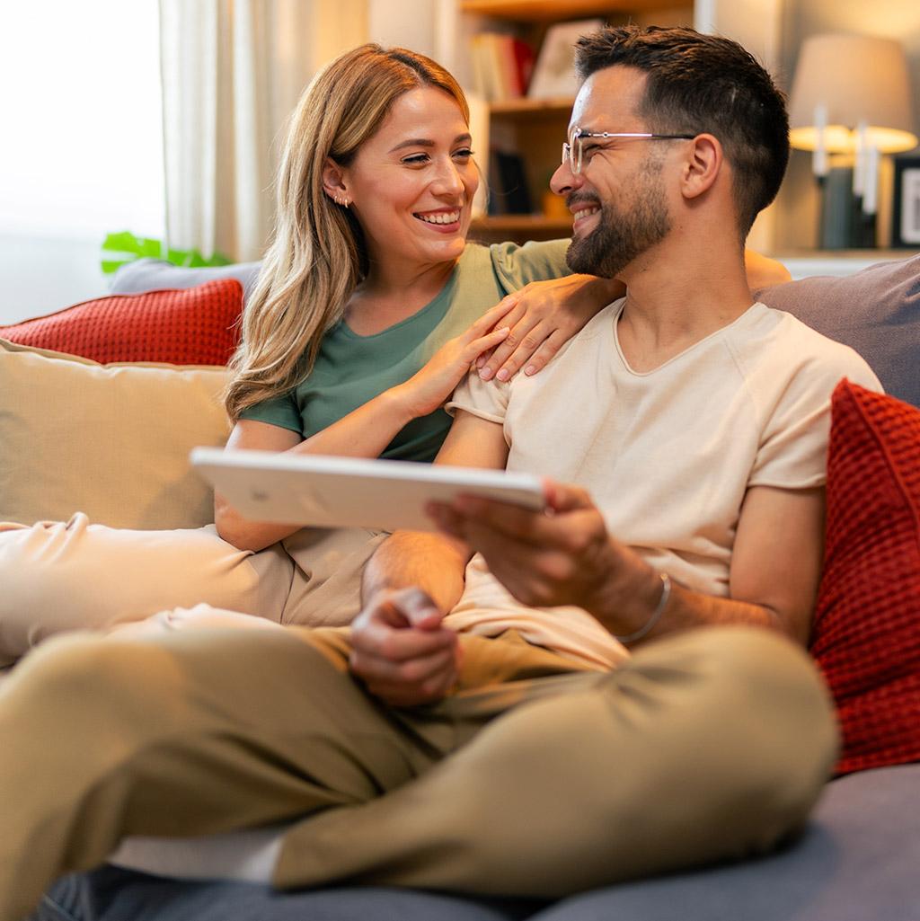 A couple looks over their destination wedding website