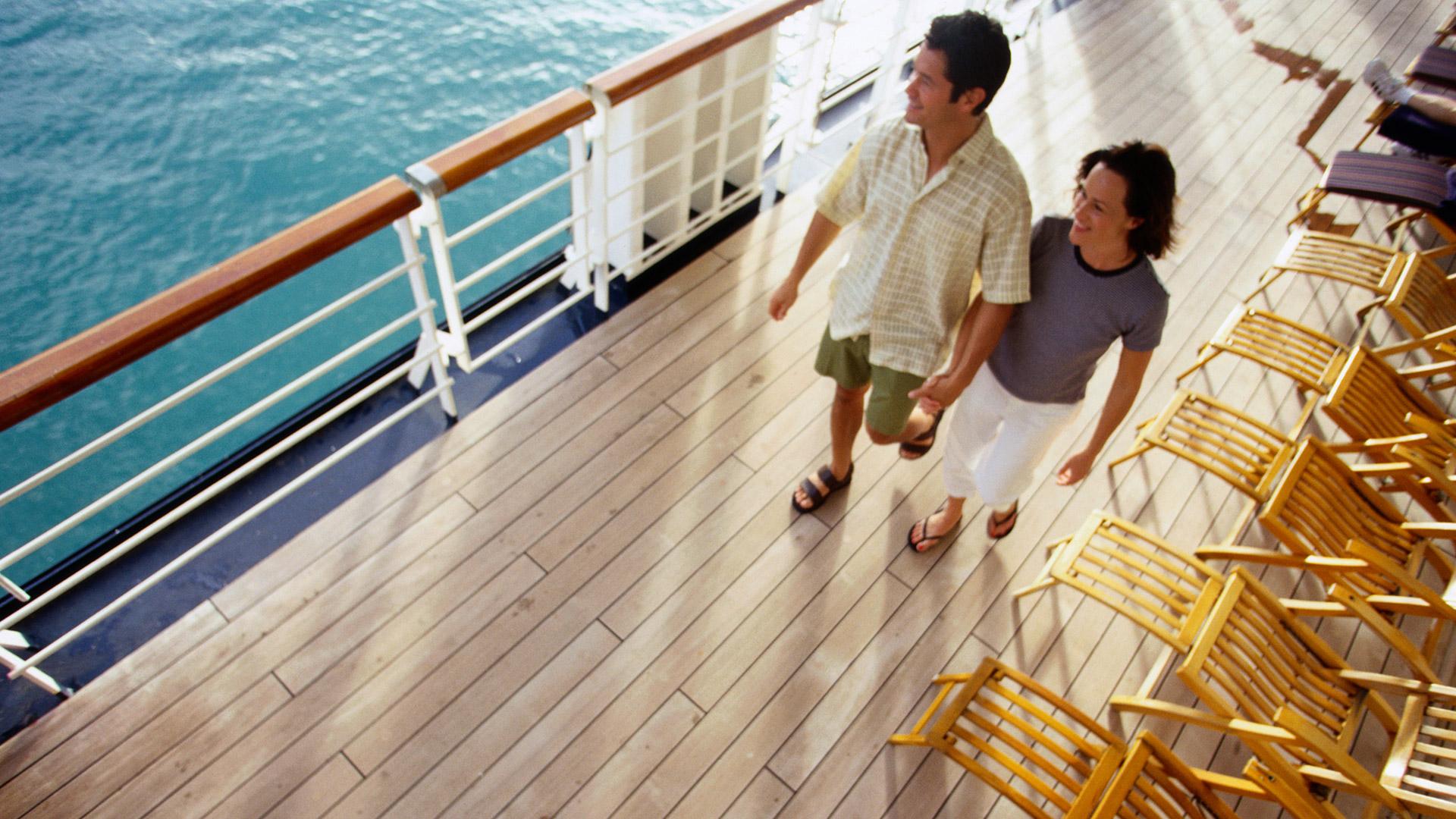 Couple strolling on a cruise ship deck