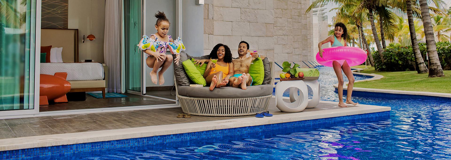 Family at a Karisma resort swim-up suite