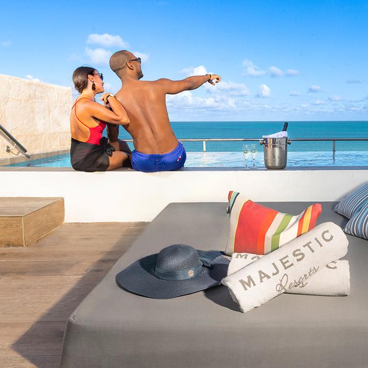 A couple enjoys the amenities of a Majestic resort