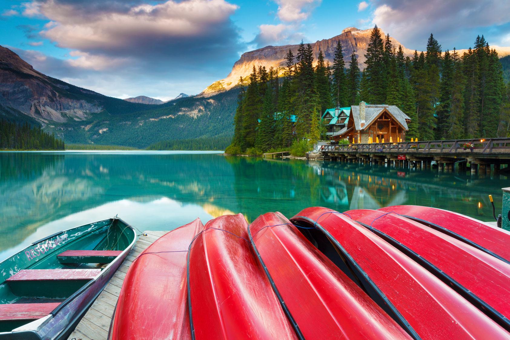 Docked row boats along lakeside Canadian lodge