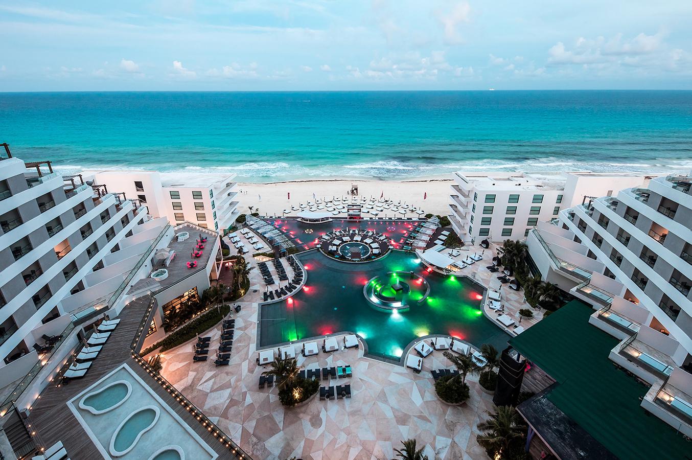 Aerial view of MelodyMaker Cancun’s beachside pool amenities