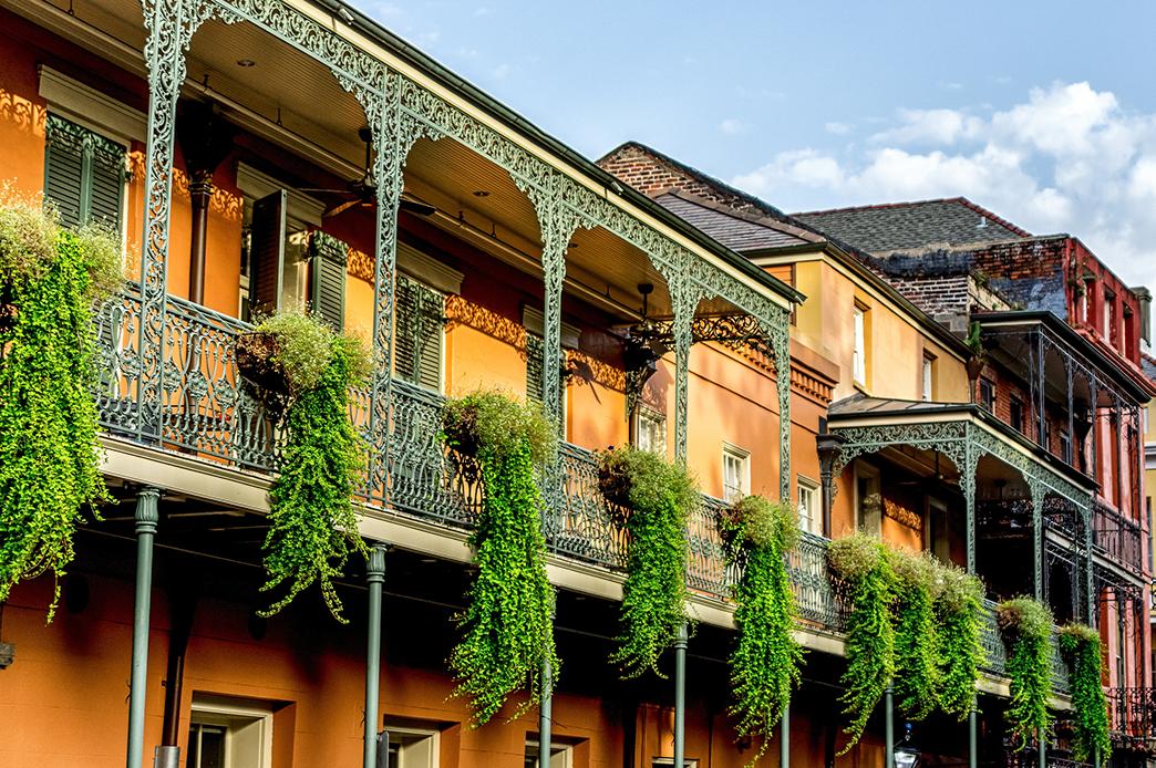 Plants hang along the sides of iron galleries in the famous French Quarter