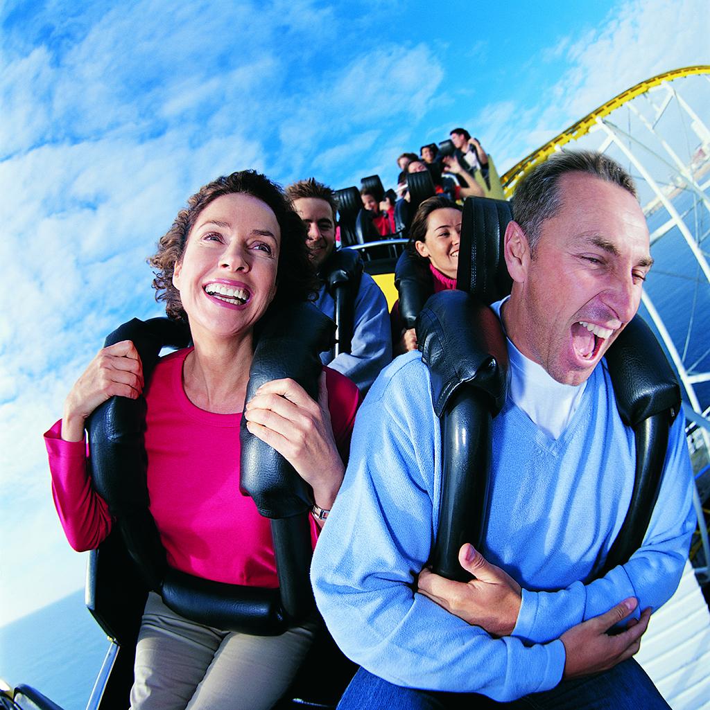 Couple riding a roller coaster in Orlando Florida