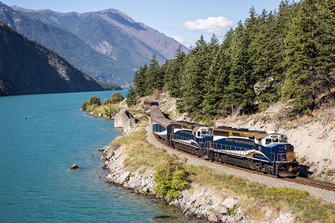 Rocky Mountaineer touring along a mountainous Canadian rail line