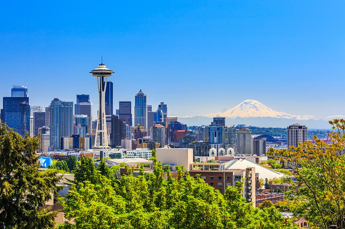 views of Seattle’s space needle and mountainous landscape