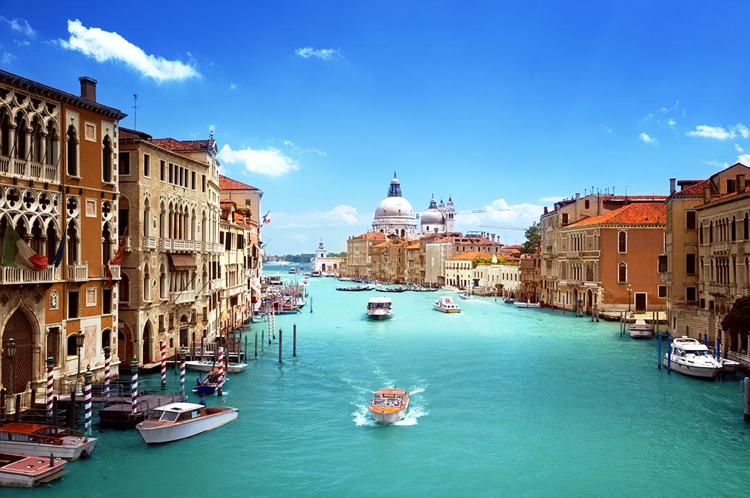 Cruise through beautiful blue canals on a Venice tour