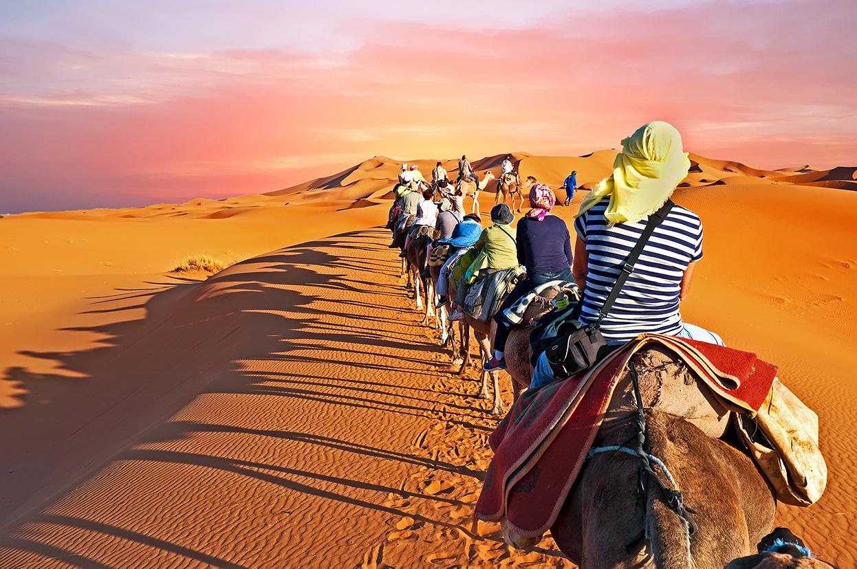 Camelback riding through the Sahara desert with Morocco tours