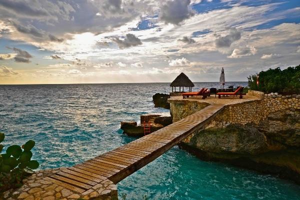 The town of Negril is renowned for its spectacular sunsets, stunning cliffs, and shallow bays