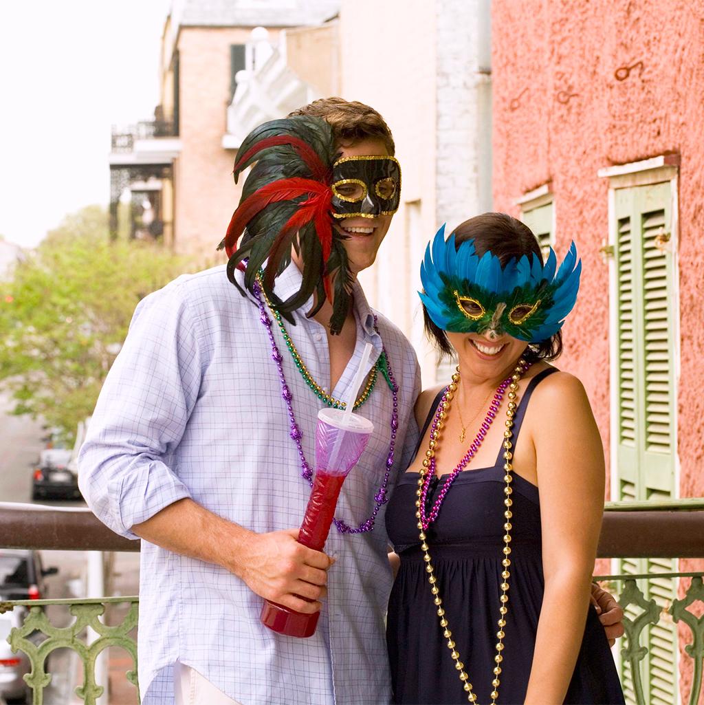 Couple wearing Masquerade masks during Mardi Gras in New Orleans