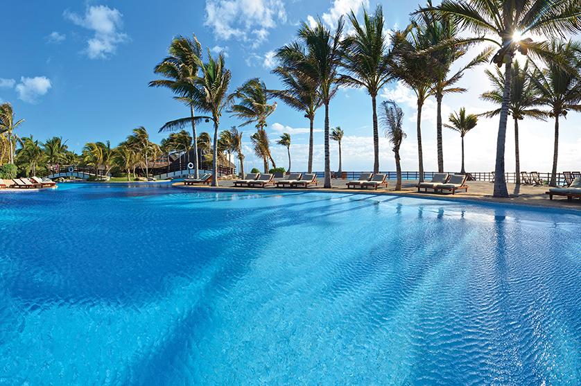 Poolside views of Oasis Hotels & Resorts. Experience all Mexico has to offer at any one of the all-inclusive family or adults-only vacations in Mexico