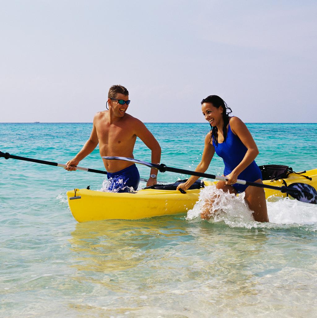 A couple kayaking on vacation in Providenciales
