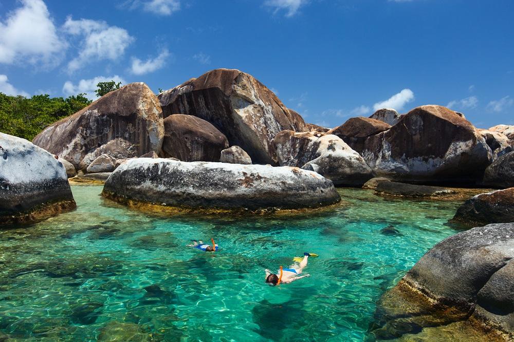 Snorkeling in Baths National Park is a fun activity to do during a family vacation in the Caribbean